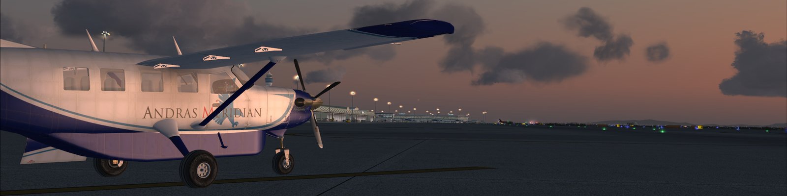 Cessna Caravan in an early Andras Meridian livery, on the ground at dusk